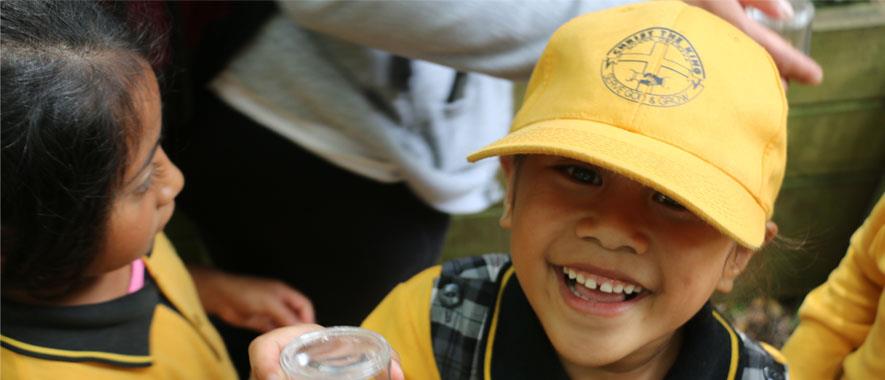 Two children investigating invertebrates.