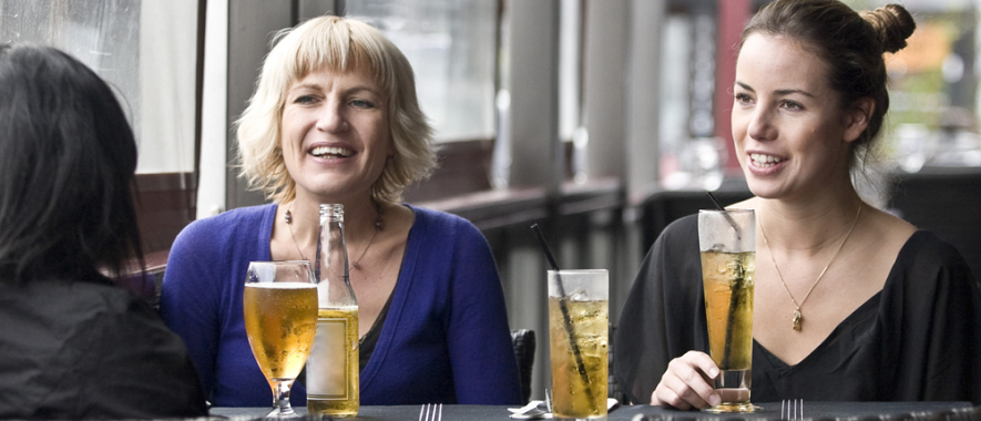 People at a table with drinks. 