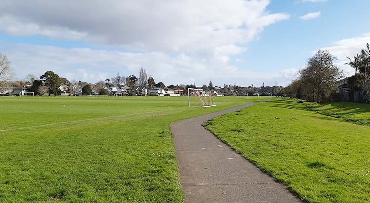 Crossfield Reserve - Sports field with a path running down the right hand side.