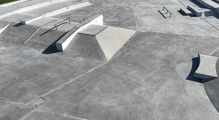 David Lange Park - Section of the skate park with ramps, rails and benches.