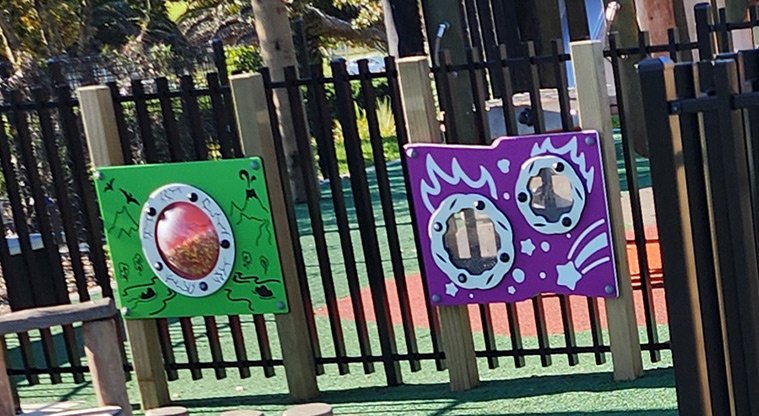 David Lange Park - Interactive play boards attached to the fence in the junior play area.