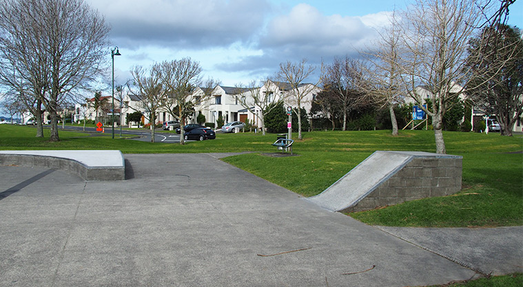 Jack Pringle Sports Park - A section of the skate park with open green space and a seat by the path. Photo credit: Tracey Hodder.