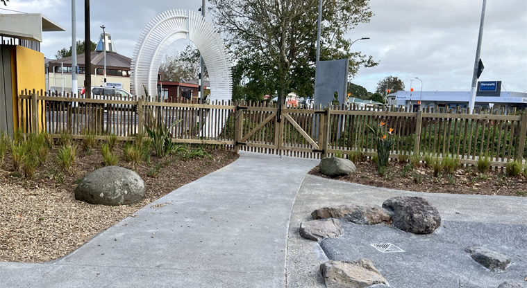 Jack Pringle Village Green - The entrance to the playground with a low fence. Photo credit: Keren Alleyne.