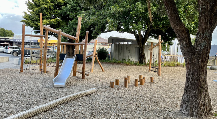 Jack Pringle Village Green - The wood-themed playground with a slide, climbing nets, stepping stools and more. Photo credit: Keren Alleyne.