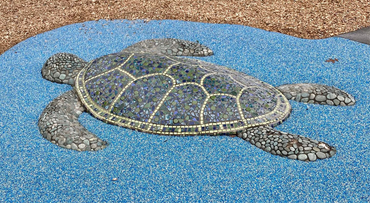 Jack Pringle Village Green - A large mosaic turtle in the ground. Photo credit: Keren Alleyne.
