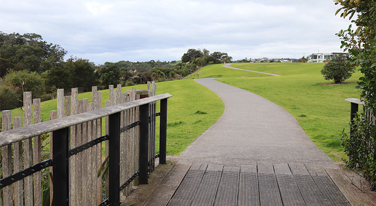 Leigh Auton Reserve - Section of Kelly's Walkway bridge with a path and open space in the background. Photo credit: S Hulse.