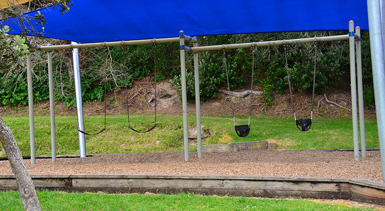 Wai Manawa / Little Shoal Bay Reserve - Swing set with two swings for older children and two for younger children. Photo credit: Aleksandar Ćirilović.