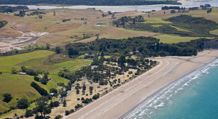 Long Bay Regional Park - aerial view of the main beach, Vaughan Stream, and Okura River (2014).