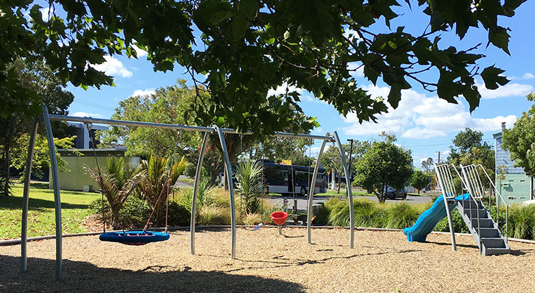 Olympic Park - Small playground with slide and swing set at the Portage Road side of the park.