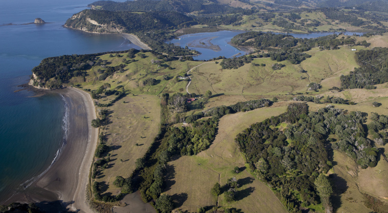 Te Muri Regional Park - Aerial view of Te Muri Beach with the Pūhoi River and Wenderholm Regional Park in the background.
